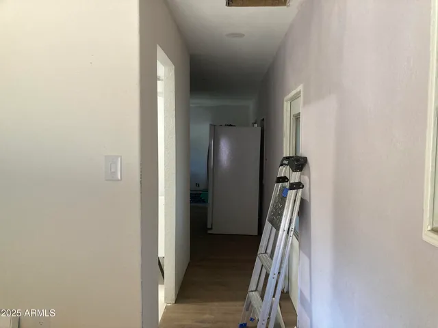 a view of a room with closet and windows