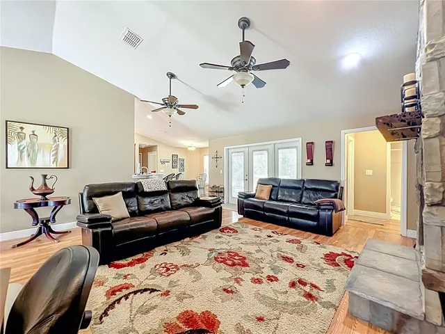 a large kitchen with stainless steel appliances granite countertop a large counter top and stainless steel appliances