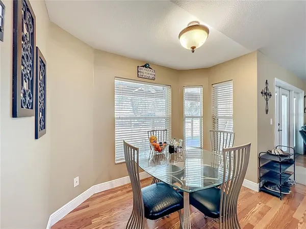 a view of a house with backyard and porch