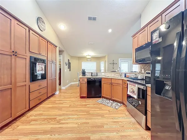 a backyard of a house with table and chairs