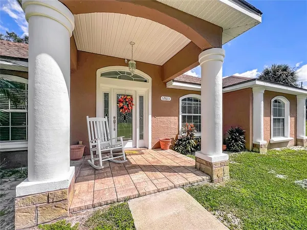 a view of a dining room with furniture wooden floor and chandelier