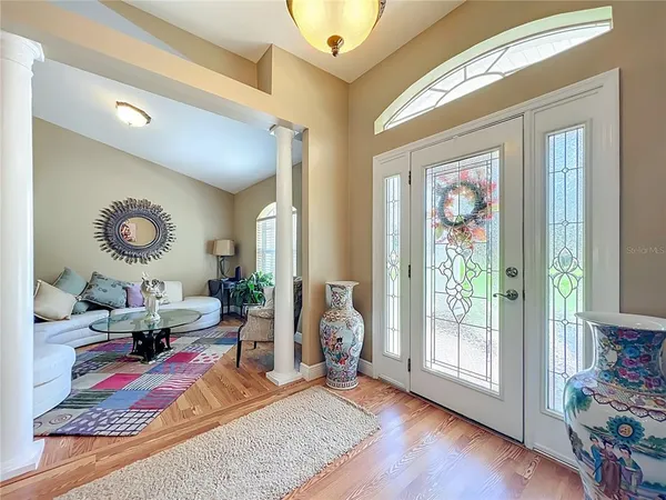 a view of a dining room with furniture and wooden floor