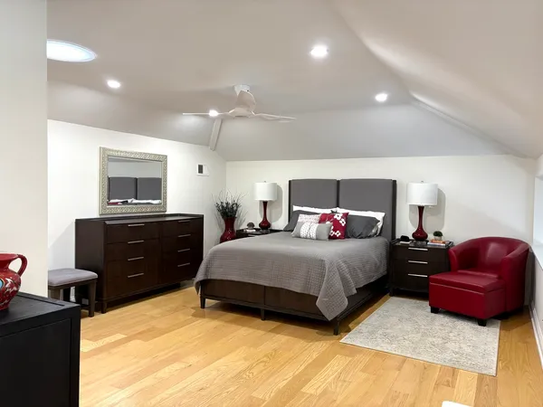 a bedroom with a bed and a couch