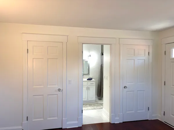 a bathroom with double sink and a mirror