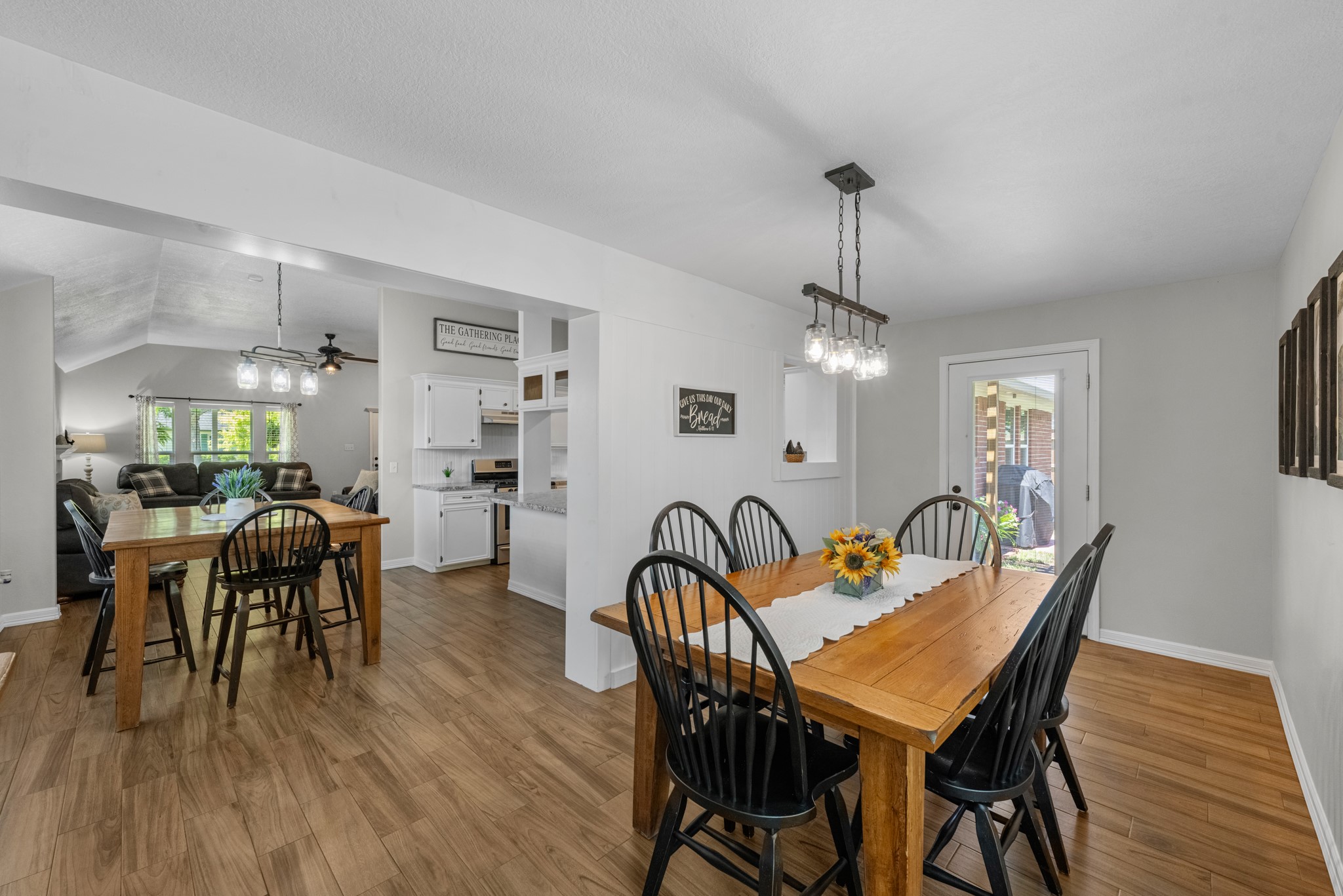 606 Walnut Street Sweeny, TX 77480 - Photo 15 of 28 a view of a dining room with furniture and wooden floor