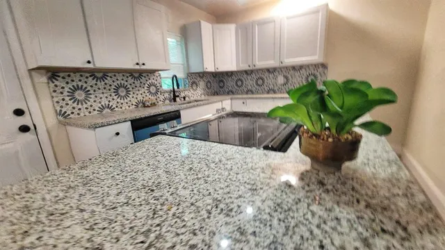 a vase of flowers sitting on a table