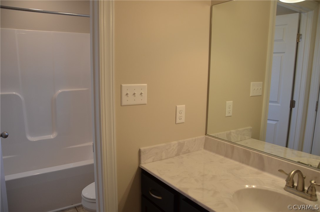 1128 Signboard Road Bumpass, VA 23024 - Photo 17 of 20 a bathroom with a sink and a vanity