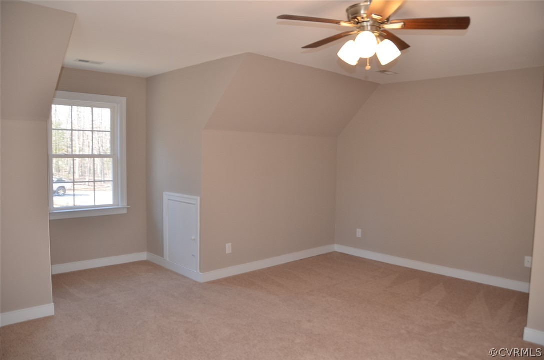 1128 Signboard Road Bumpass, VA 23024 - Photo 19 of 20 an empty room with a window and a fan