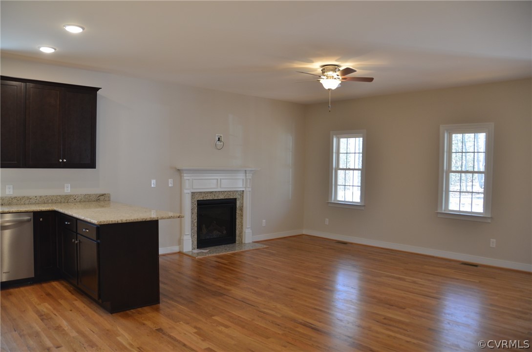 1128 Signboard Road Bumpass, VA 23024 - Photo 8 of 20 a view of a kitchen with a sink cabinet and a fireplace