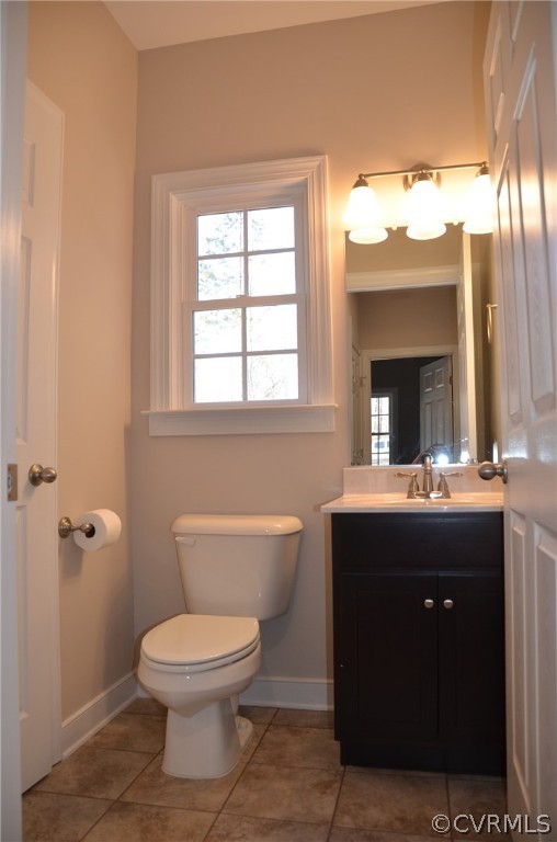 1128 Signboard Road Bumpass, VA 23024 - Photo 10 of 20 a bathroom with a toilet sink and mirror