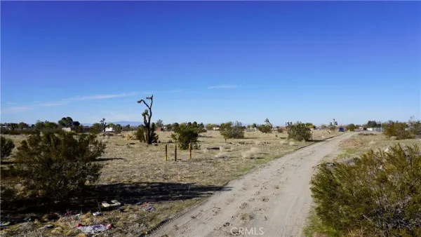 a view of a beach with a building in the background