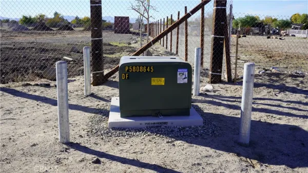 a view of a wooden deck and a backyard