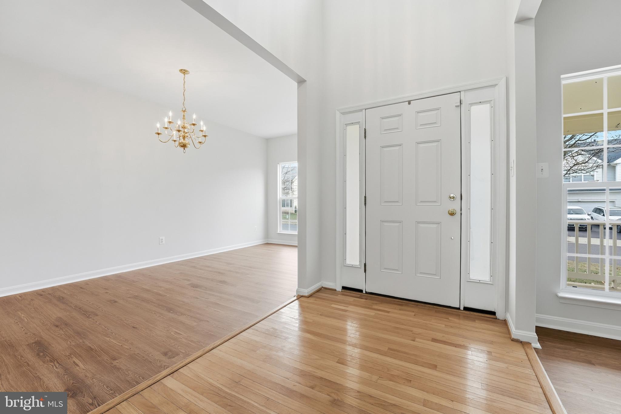901 Woodcrest Loop Culpeper, VA 22701 - Photo 15 of 61 an empty room with wooden floor and windows