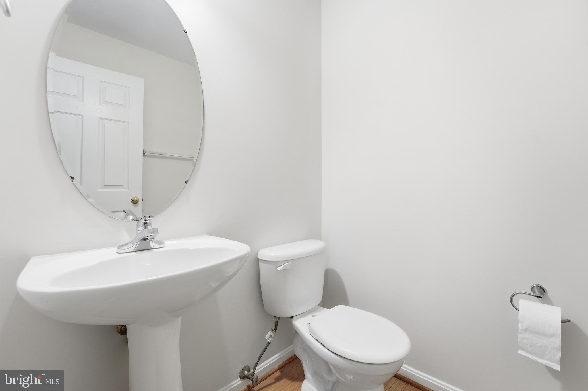901 Woodcrest Loop Culpeper, VA 22701 - Photo 17 of 61 a bathroom with a toilet a sink and a mirror