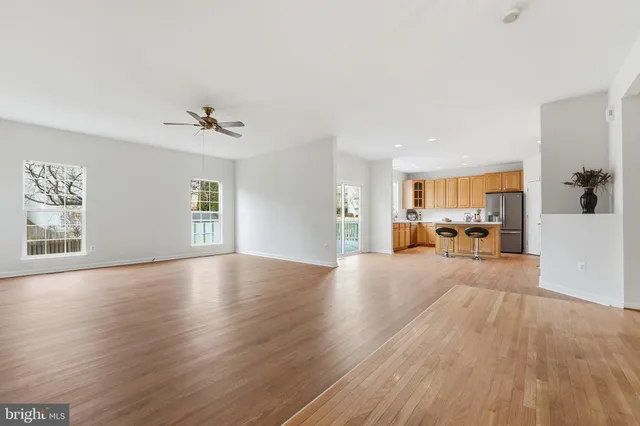 a kitchen with stainless steel appliances a sink stove and refrigerator