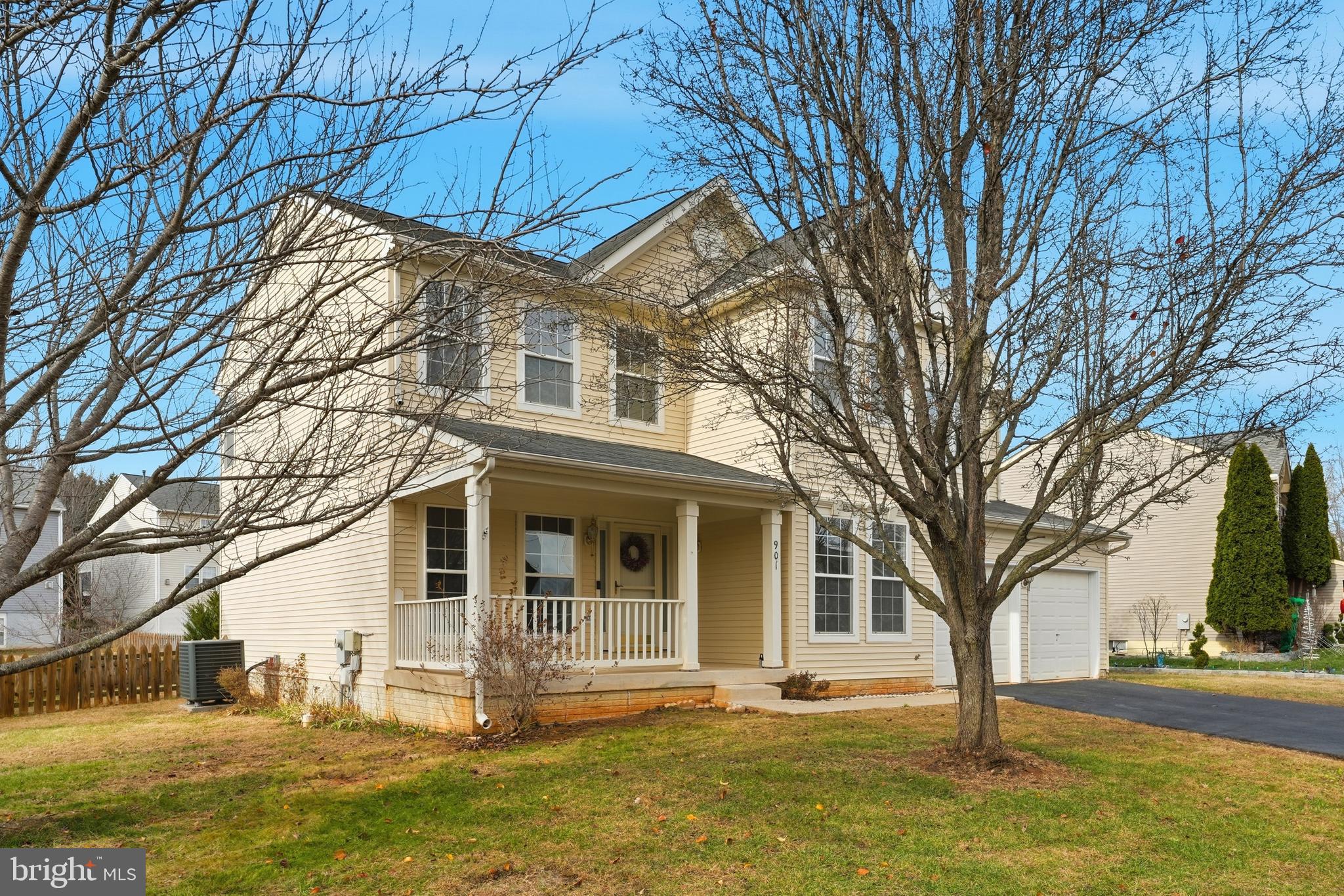 901 Woodcrest Loop Culpeper, VA 22701 - Photo 2 of 61 a front view of a house with a yard