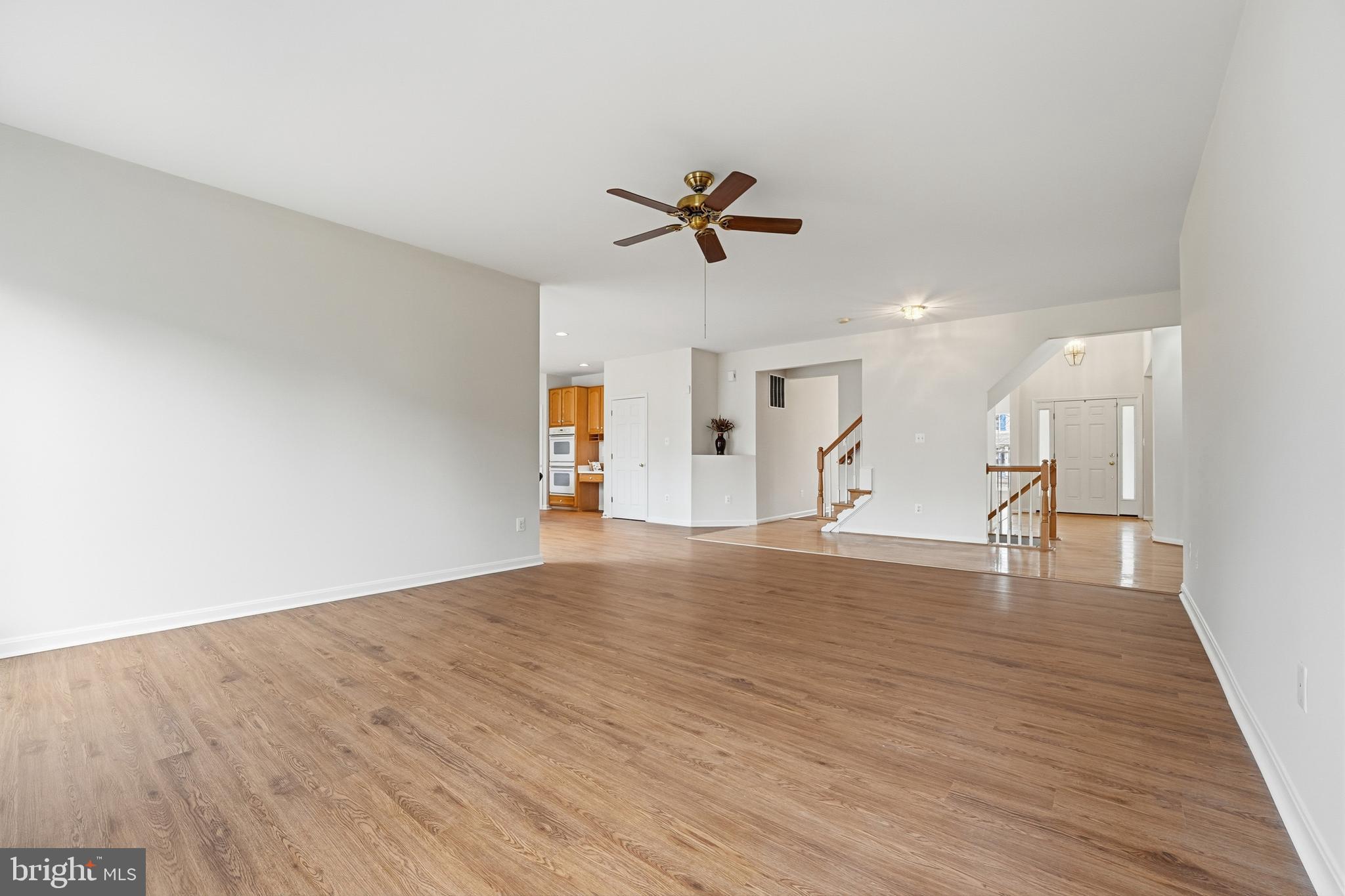 901 Woodcrest Loop Culpeper, VA 22701 - Photo 21 of 61 a view of empty room with wooden floor and ceiling fan