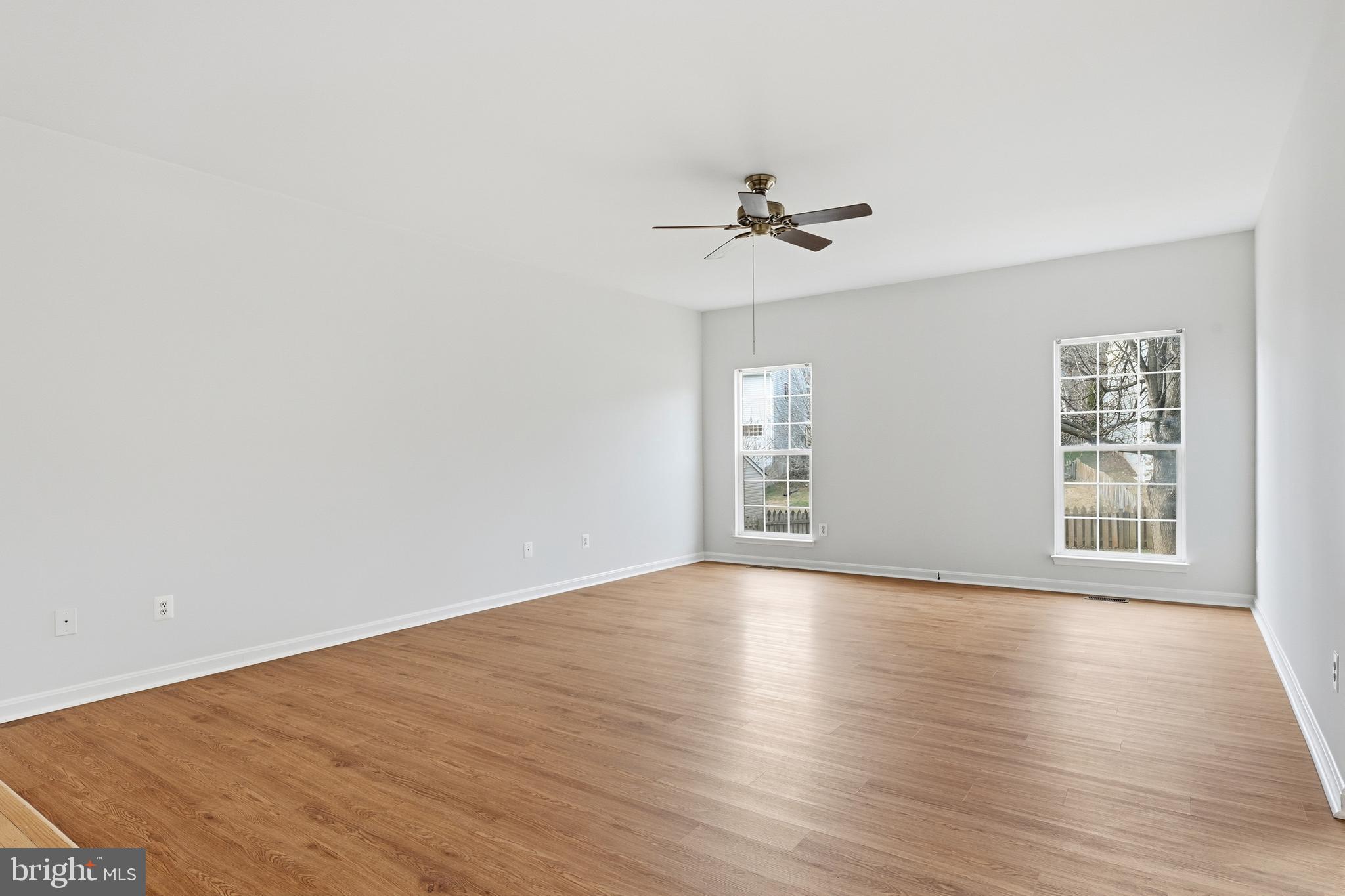 901 Woodcrest Loop Culpeper, VA 22701 - Photo 22 of 61 a view of empty room with wooden floor and fan