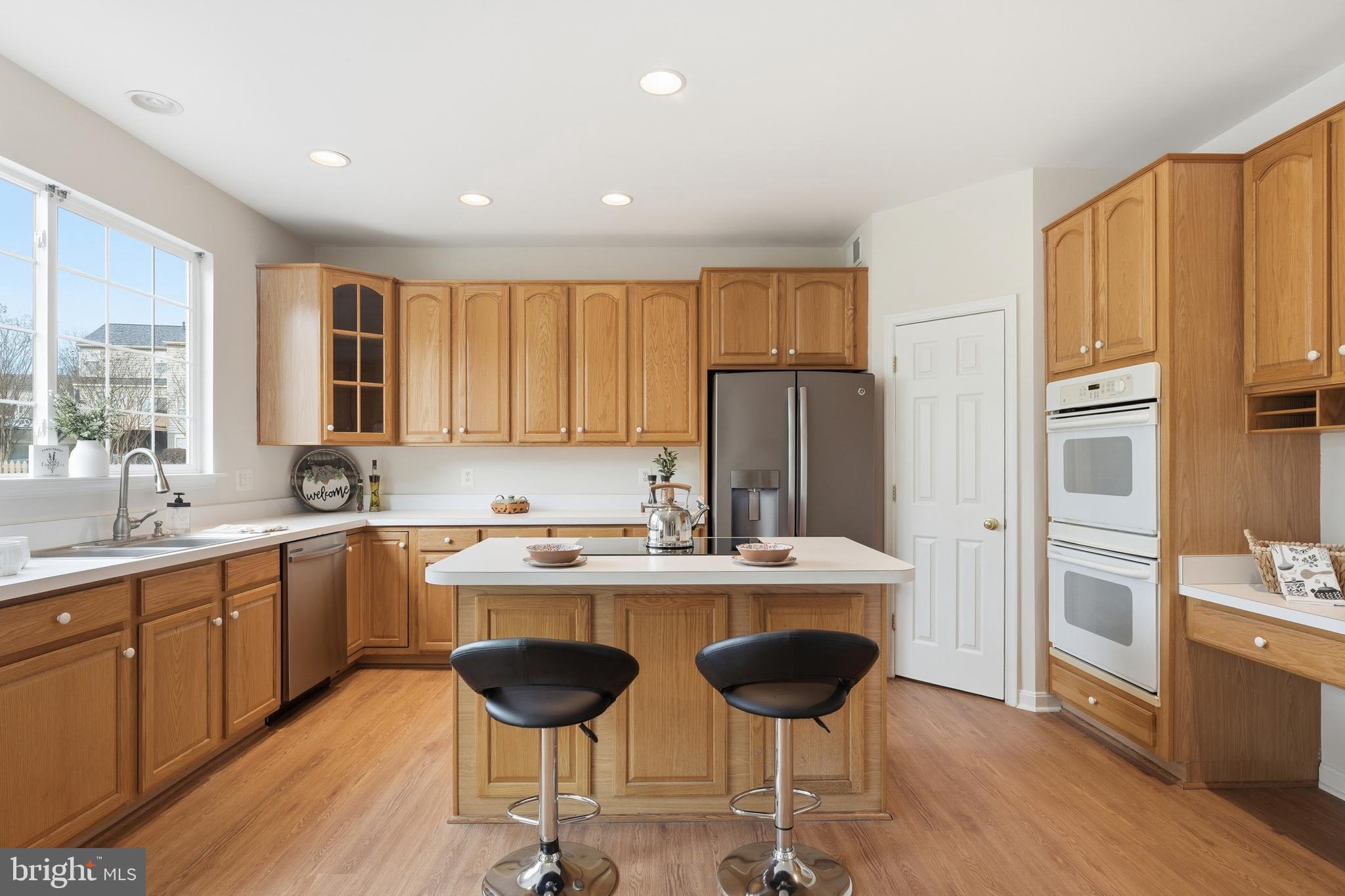 901 Woodcrest Loop Culpeper, VA 22701 - Photo 23 of 61 a kitchen with stainless steel appliances a sink stove and refrigerator