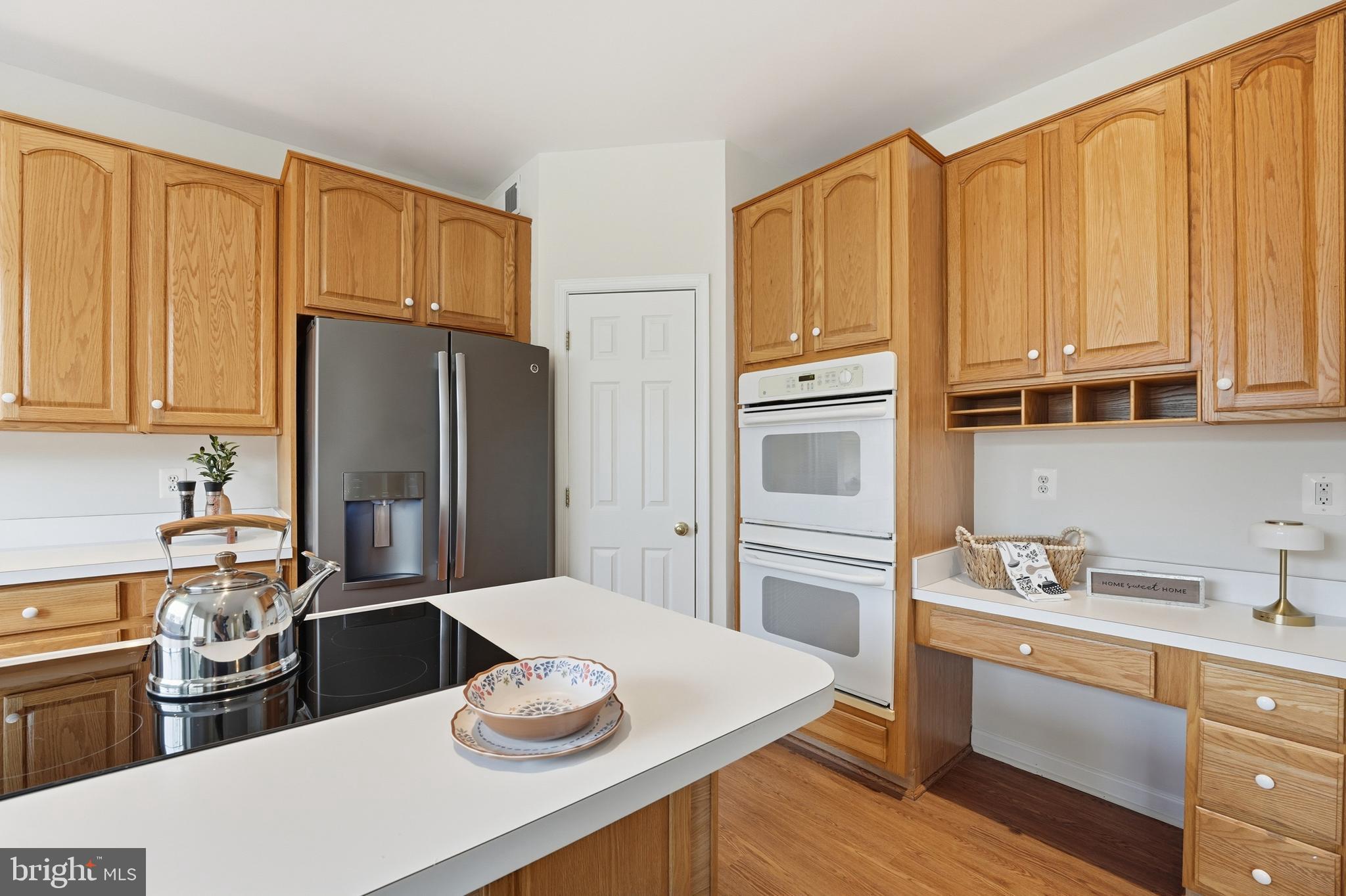 901 Woodcrest Loop Culpeper, VA 22701 - Photo 27 of 61 a kitchen with stainless steel appliances a refrigerator sink and cabinets