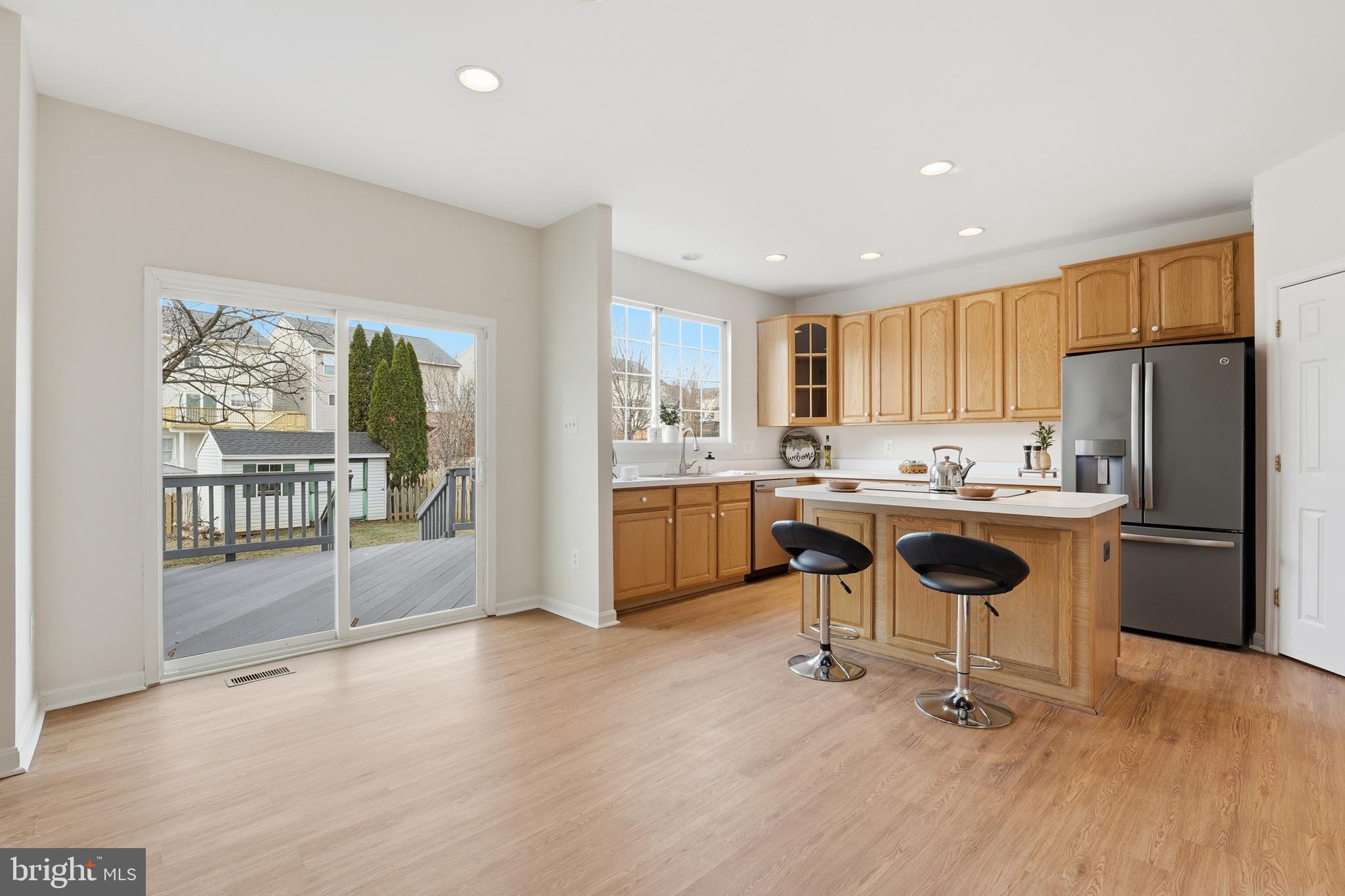 901 Woodcrest Loop Culpeper, VA 22701 - Photo 29 of 61 a kitchen with a table chairs refrigerator and microwave