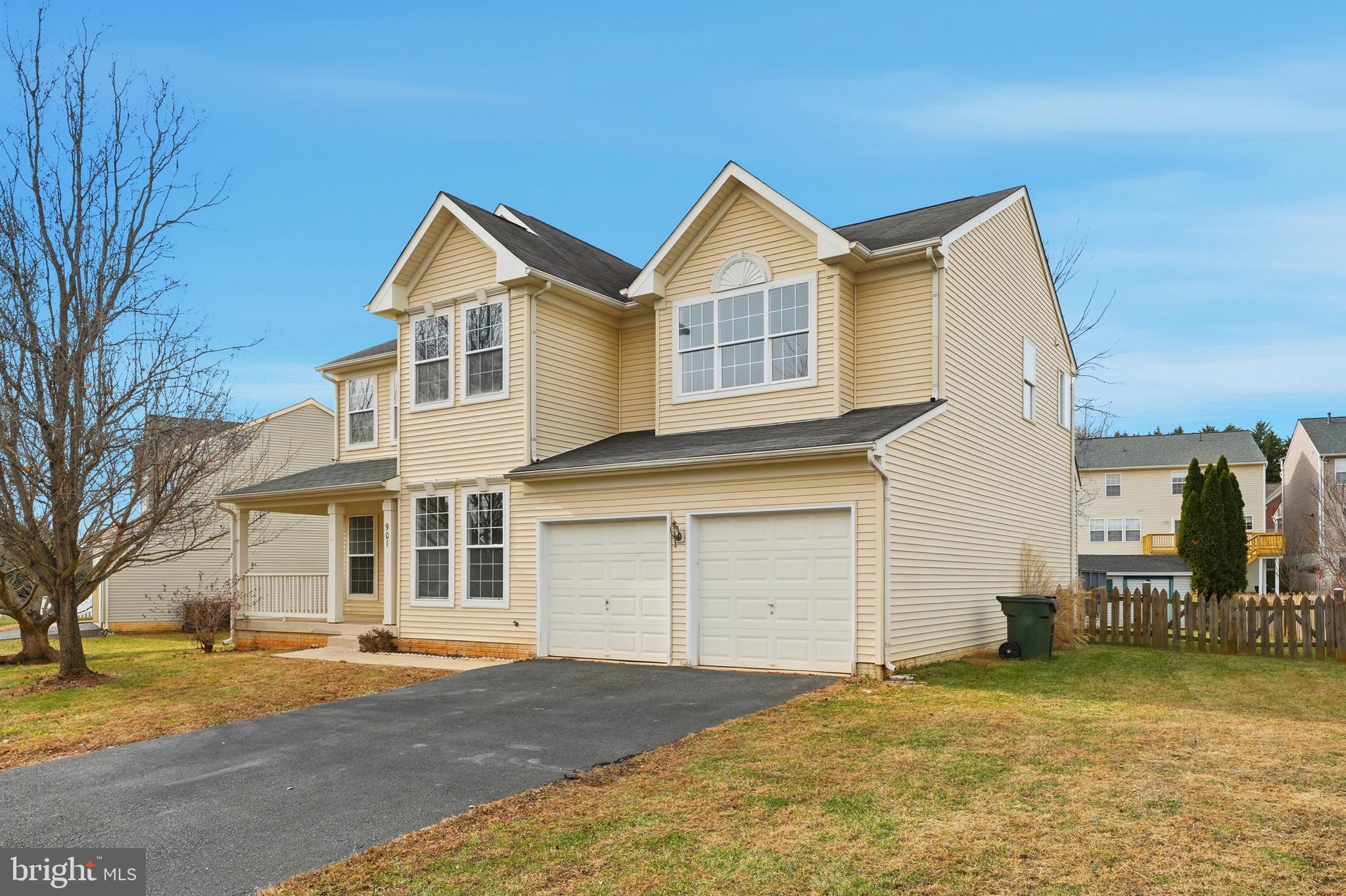 901 Woodcrest Loop Culpeper, VA 22701 - Photo 3 of 61 a front view of a house with a yard and garage