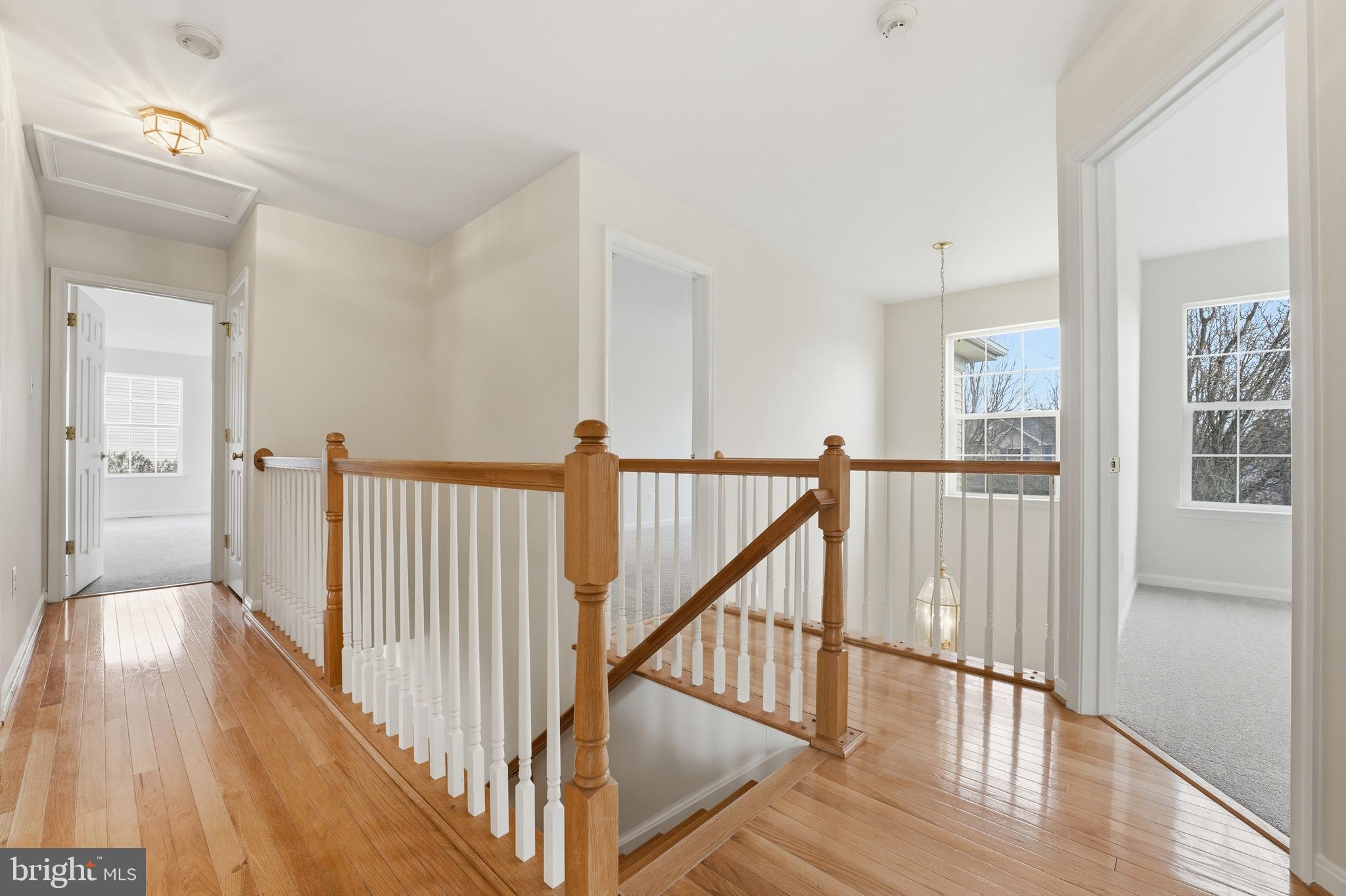 901 Woodcrest Loop Culpeper, VA 22701 - Photo 31 of 61 a view of a hallway with wooden floor and stairs