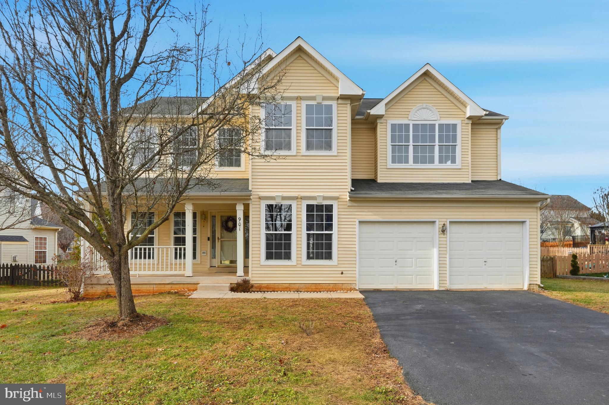 901 Woodcrest Loop Culpeper, VA 22701 - Photo 4 of 61 a front view of a house with a yard and garage