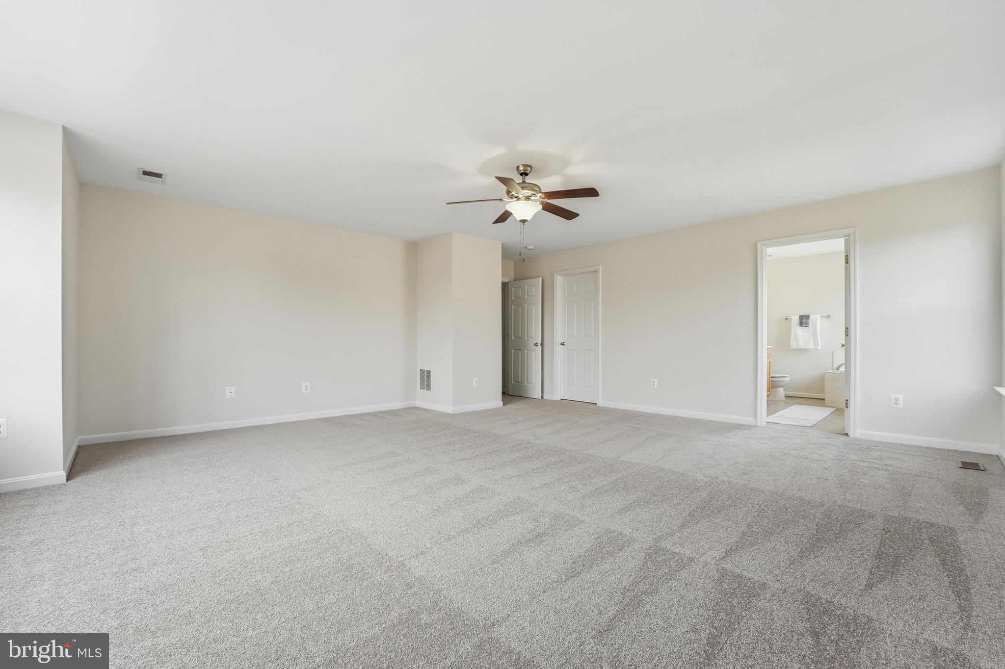 901 Woodcrest Loop Culpeper, VA 22701 - Photo 42 of 61 a view of an empty room with a ceiling fan