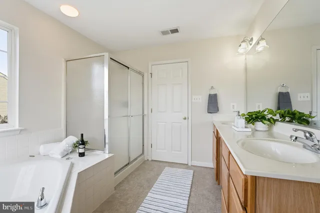 a view of a house with wooden deck