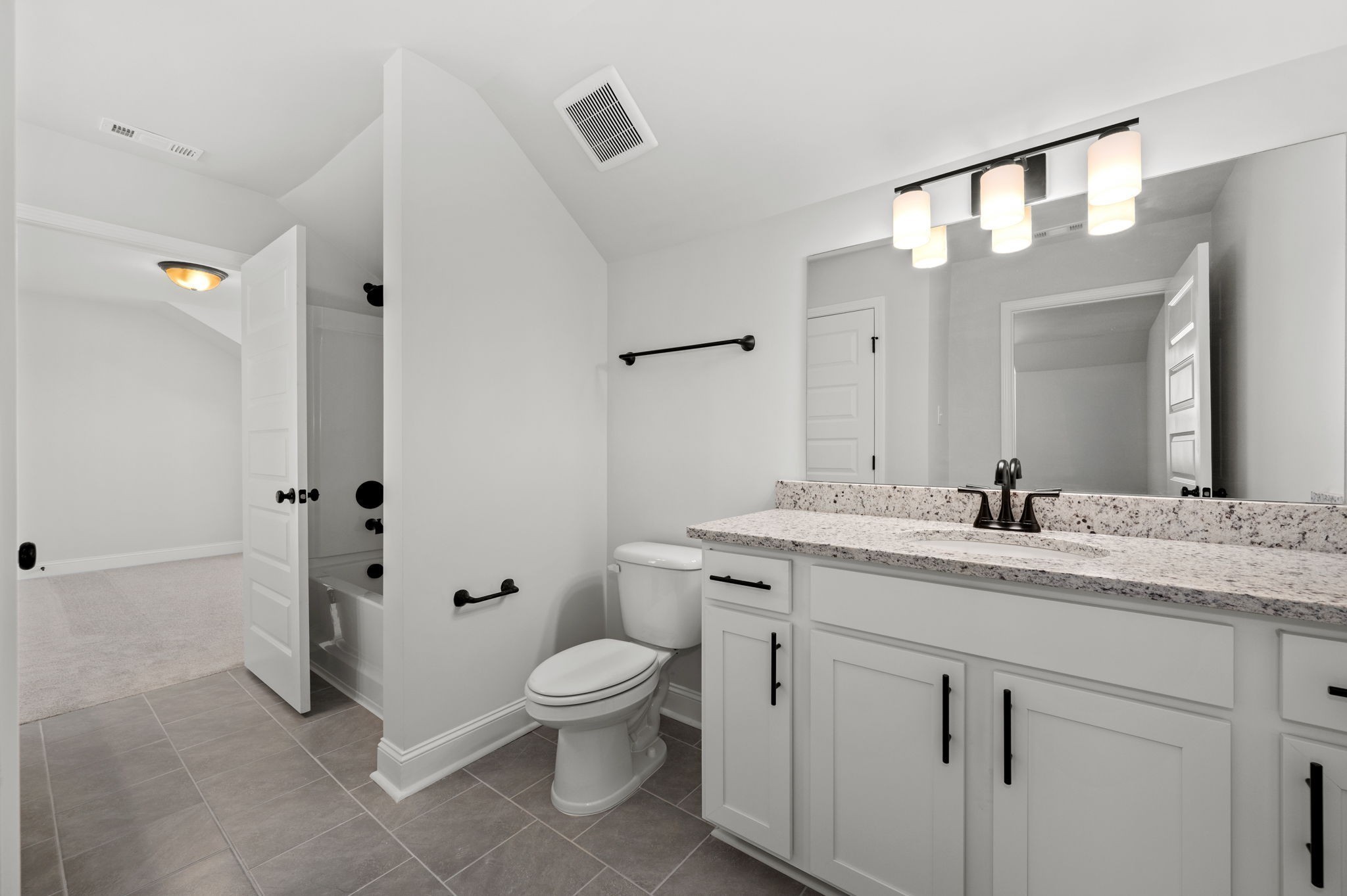527 Rohan Drive Murfreesboro, TN 37129 - Photo 13 of 20 a bathroom with a granite countertop toilet sink and mirror