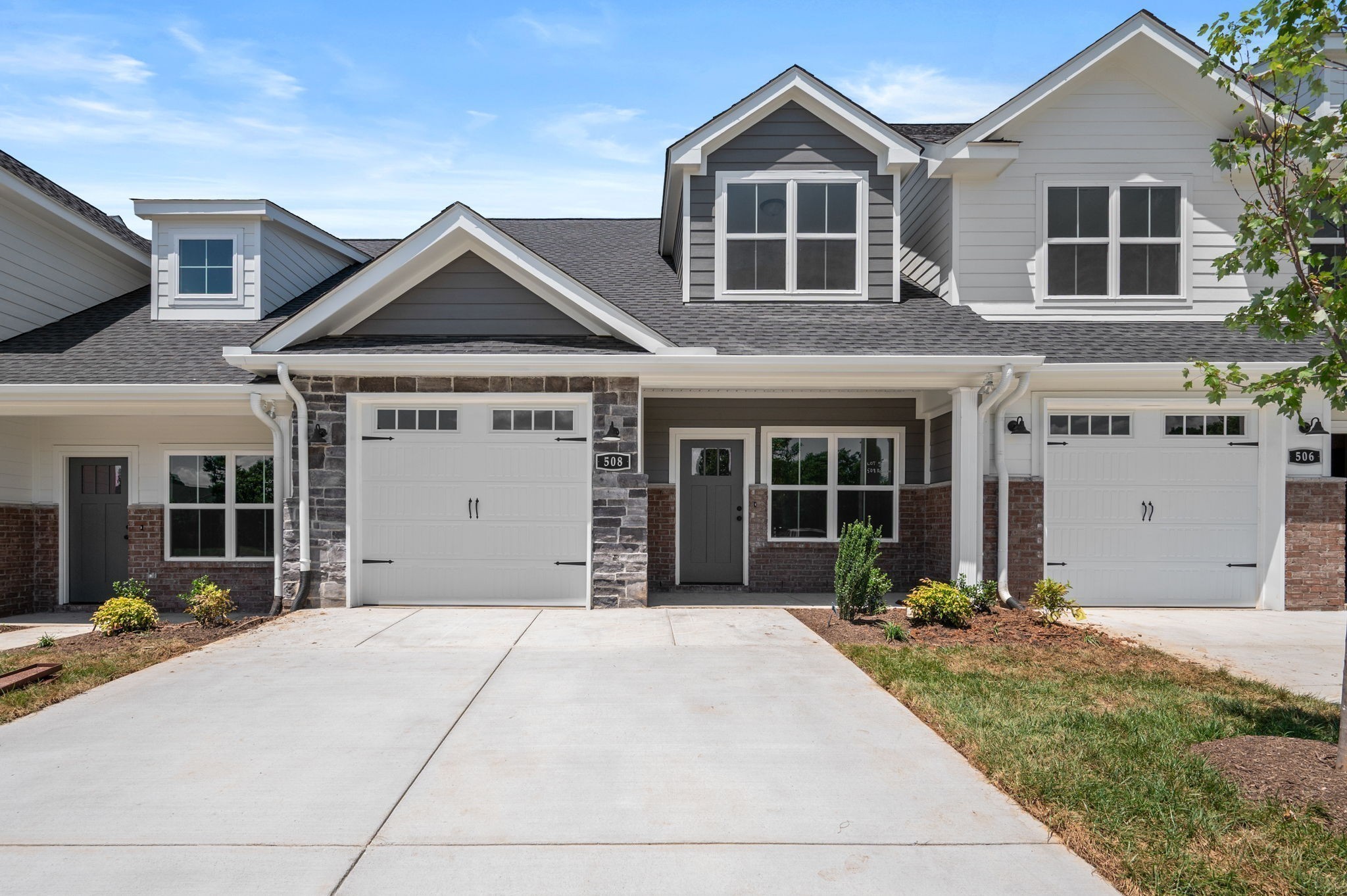 527 Rohan Drive Murfreesboro, TN 37129 - Photo 7 of 20 a front view of a house with a yard and garage