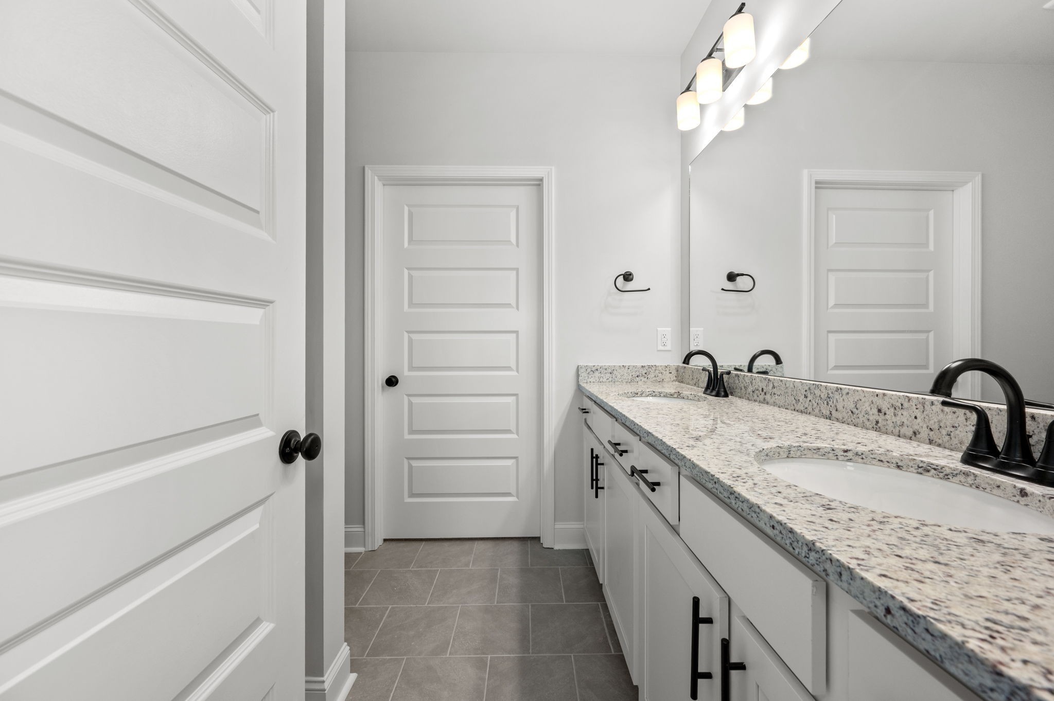 527 Rohan Drive Murfreesboro, TN 37129 - Photo 9 of 20 a bathroom with a granite countertop sink double vanity and a mirror