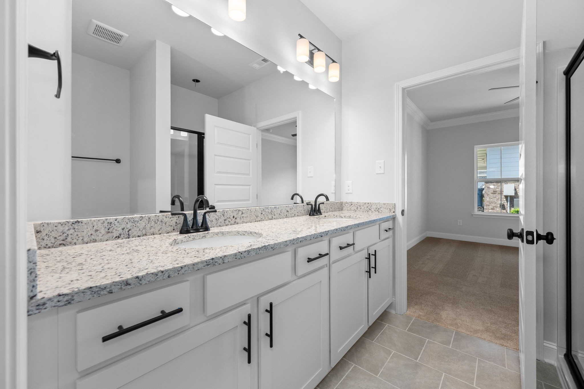 527 Rohan Drive Murfreesboro, TN 37129 - Photo 10 of 20 a spacious bathroom with a granite countertop sink and a mirror