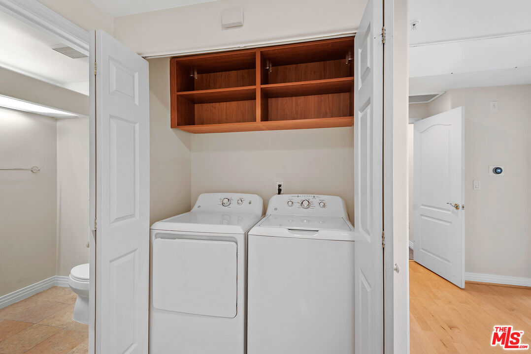 11540 Rochester Avenue, Unit 103 Los Angeles, CA 90025 - Photo 12 of 15 a utility room with dryer and washer