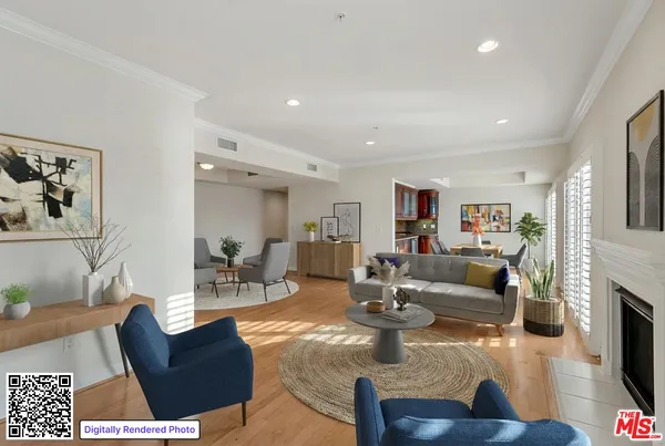 a living room with fireplace furniture and a wooden floor