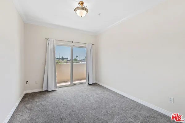 an empty room with a bathroom