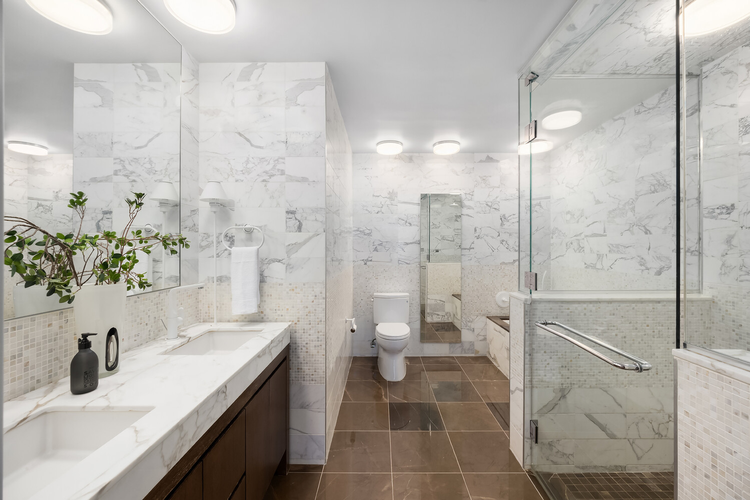 35 West 15th Street, Unit 13C Manhattan, NY 10011 - Photo 10 of 17 a bathroom with a sink a toilet and shower