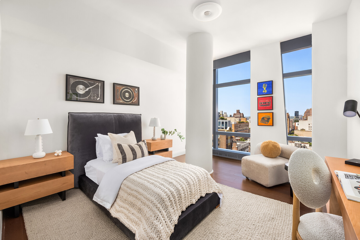 35 West 15th Street, Unit 13C Manhattan, NY 10011 - Photo 13 of 17 a bedroom with a bed and a couch