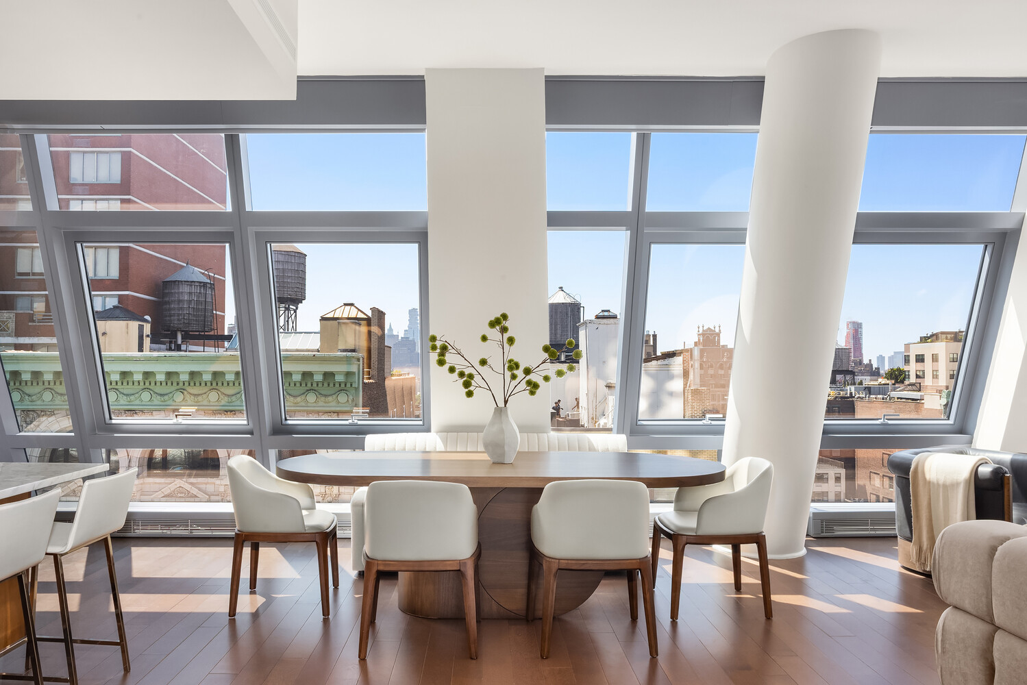 35 West 15th Street, Unit 13C Manhattan, NY 10011 - Photo 16 of 17 a view of a dining room with furniture wooden floor and a large window