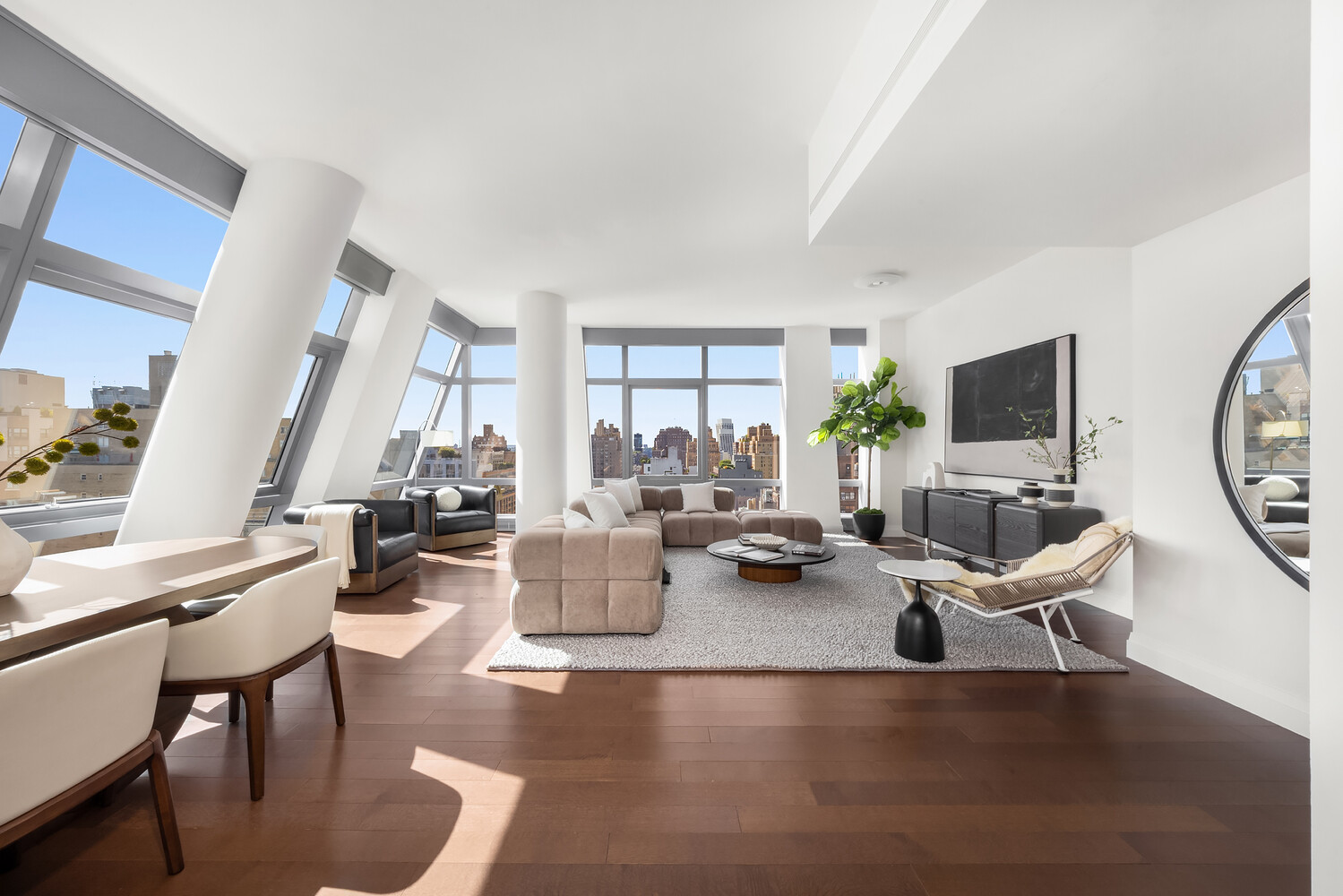 35 West 15th Street, Unit 13C Manhattan, NY 10011 - Photo 5 of 17 a living room with furniture and a flat screen tv