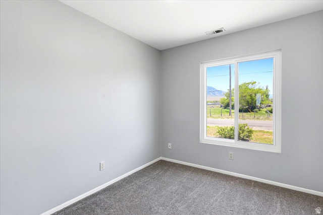 1613 Sunset Road Lake Point, UT 84074 - Photo 15 of 33 Bright interior space featuring a large window with a scenic outdoor setting