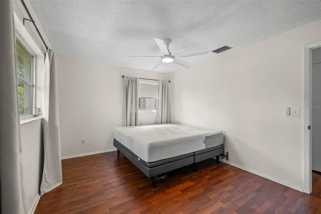 a room with a bed and a window