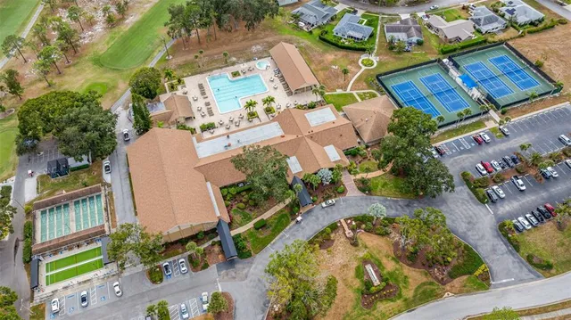 an aerial view of a house with a swimming pool