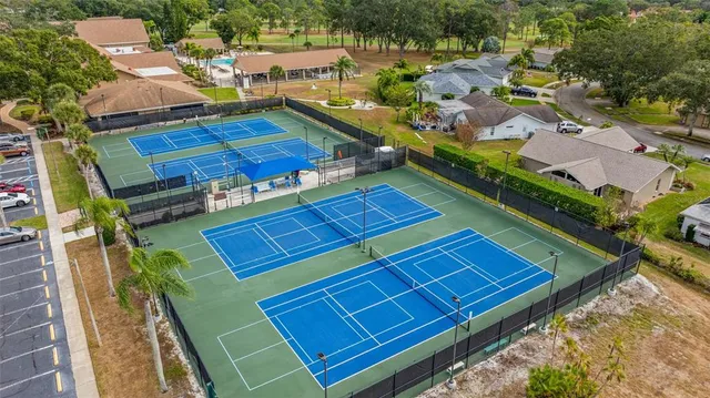 an aerial view of a house with a big yard