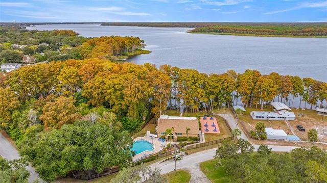 a aerial view of a house with a yard and garden