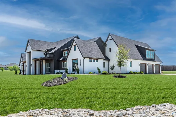 a front view of house with yard and green space