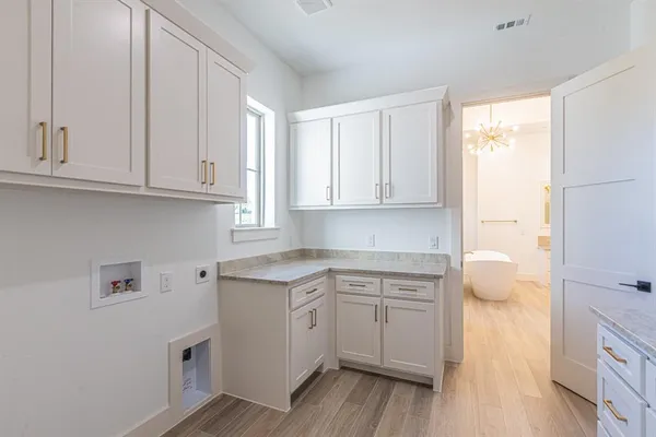 a kitchen with a white cabinets and sink