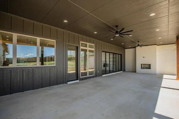 a view of a hallway with a ceiling fan