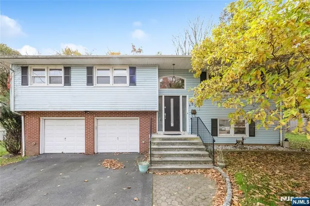 a front view of a house with a garage